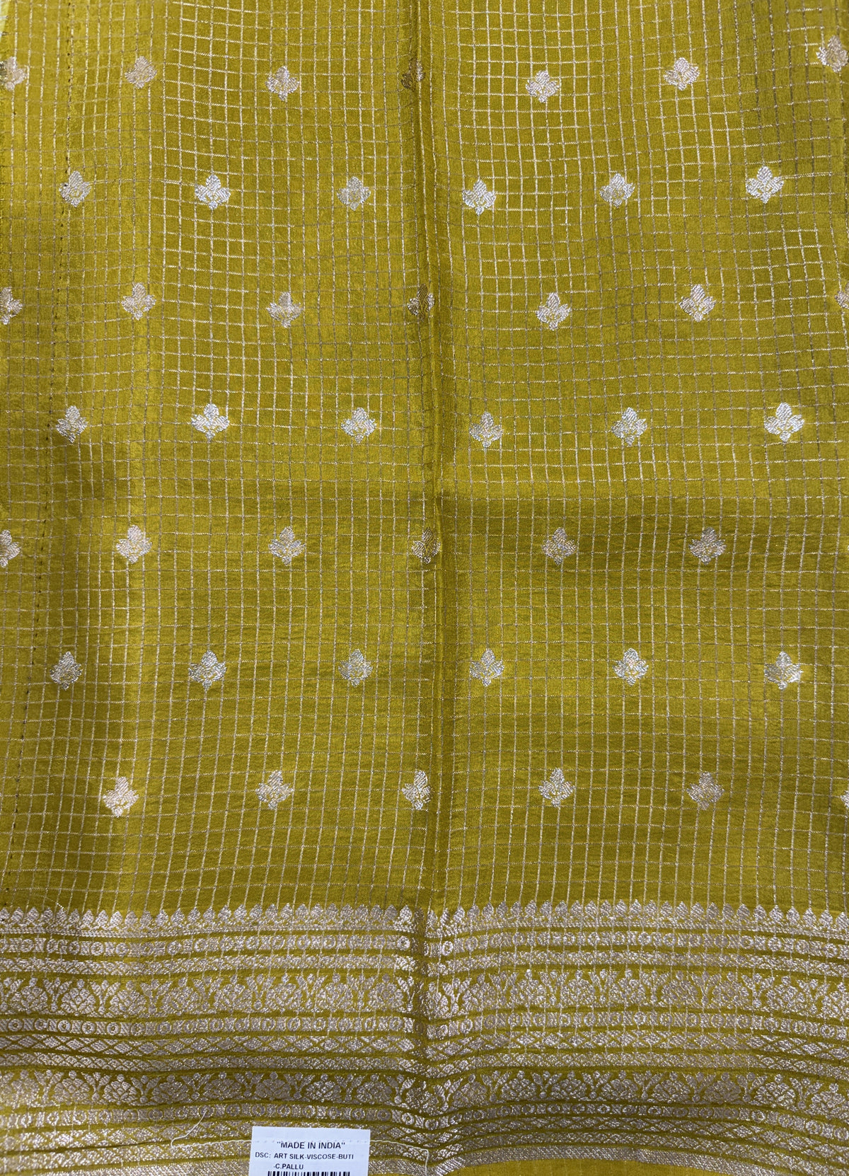 Banarasi Fancy Saree Brown Colored Complemented with a Yellow Zari Border.