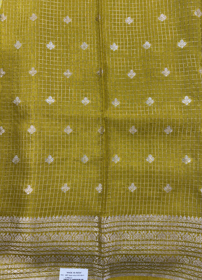 Banarasi Fancy Saree Brown Colored Complemented with a Yellow Zari Border.