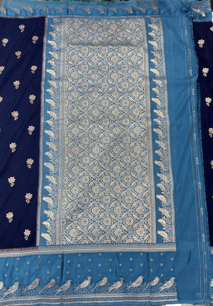 Banarasi Fancy Saree Navy Blue Colored Complemented with a Blue Zari Border.
