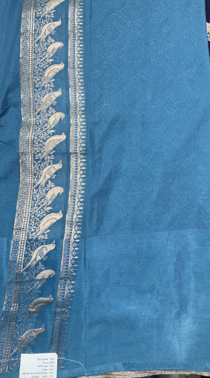 Banarasi Fancy Saree Navy Blue Colored Complemented with a Blue Zari Border.