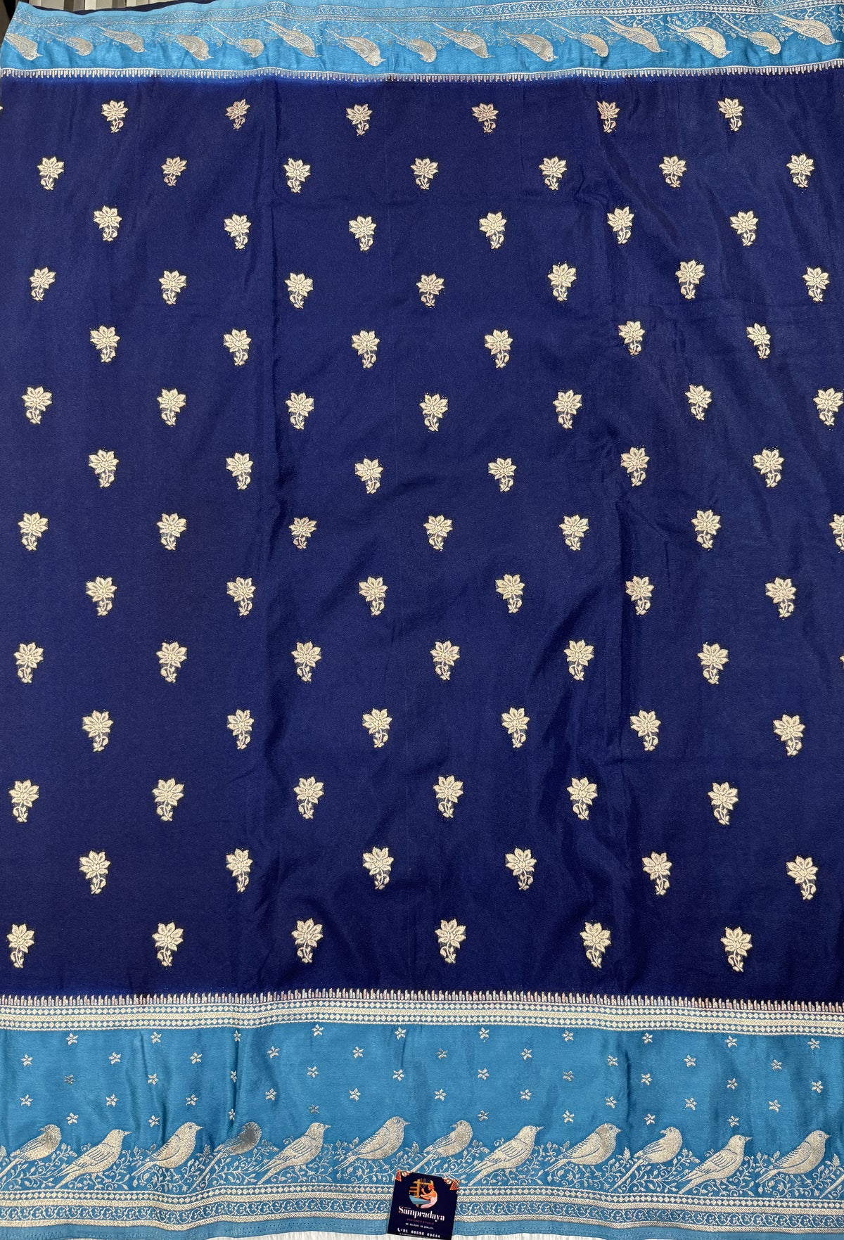 Banarasi Fancy Saree Navy Blue Colored Complemented with a Blue Zari Border.