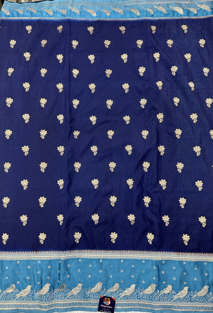 Banarasi Fancy Saree Navy Blue Colored Complemented with a Blue Zari Border.