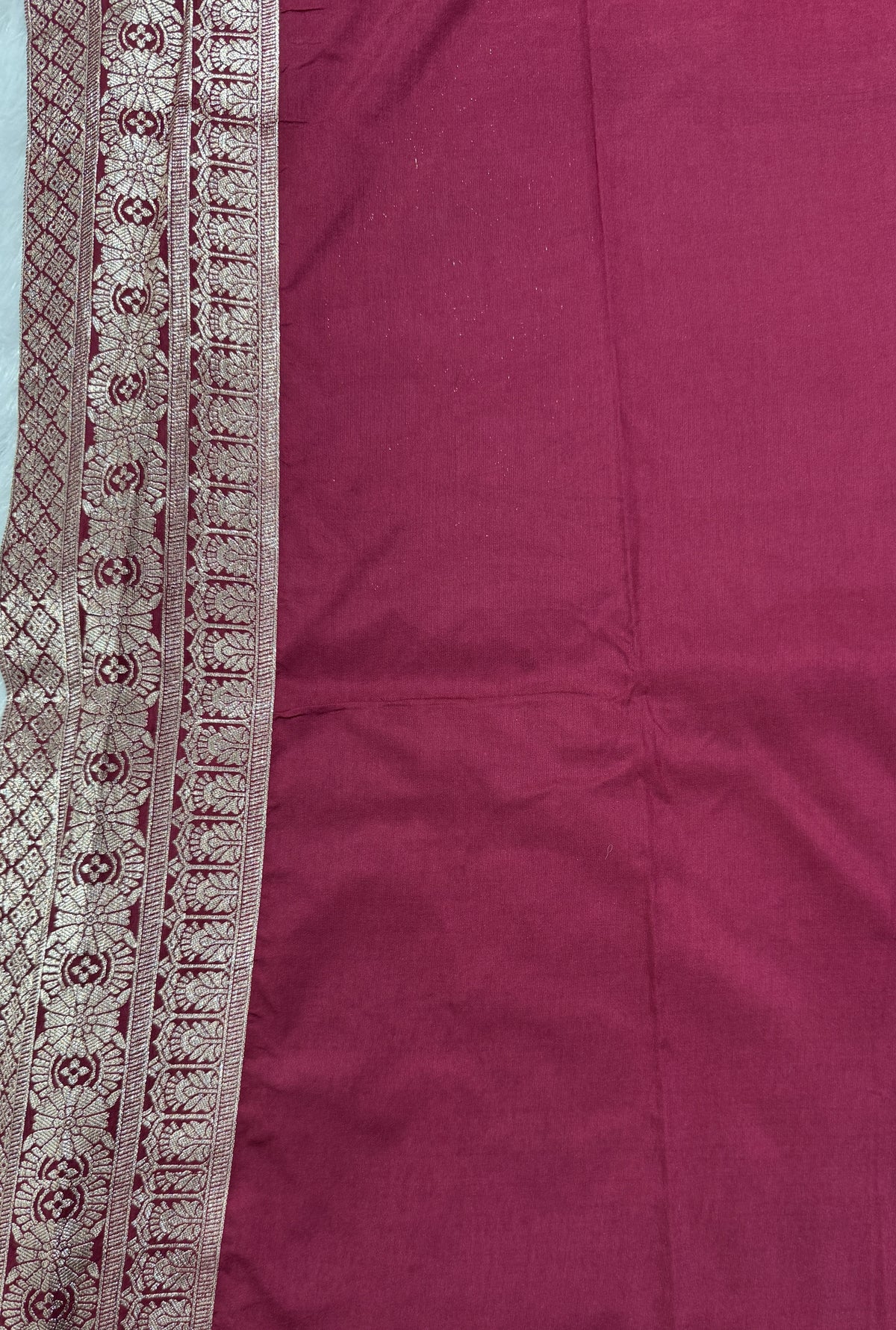 Banarasi Fancy Saree Teal Blue Colored Complemented with a Magenta Zari Border.