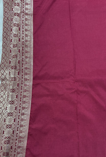 Banarasi Fancy Saree Teal Blue Colored Complemented with a Magenta Zari Border.