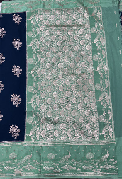Banarasi Fancy Saree Dark Teal Blue Blue Colored Complemented with a Light Green Zari Border.