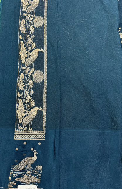 Banarasi Fancy Saree Dark Teal Blue Blue Colored Complemented with a Light Green Zari Border.