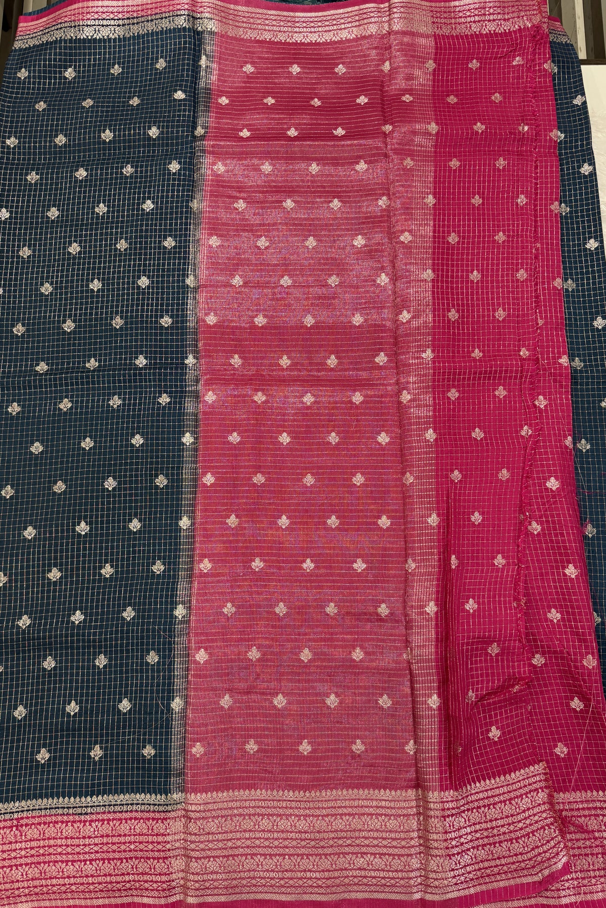 Banarasi Fancy Saree Dark Teal Blue Colored Complemented with a Yellow Zari Border.