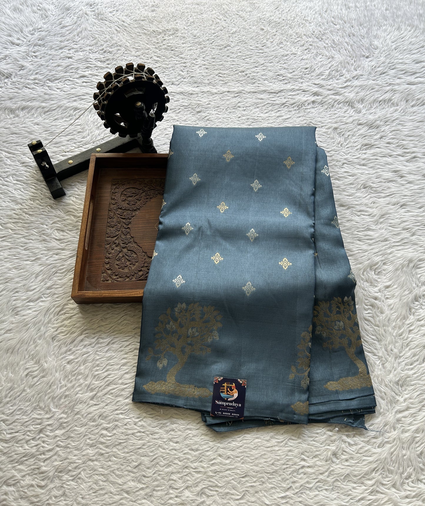 Mona Silk Saree Teal Blue Colored Complemented with a Buti Border. - Sampradaya Designer Studio