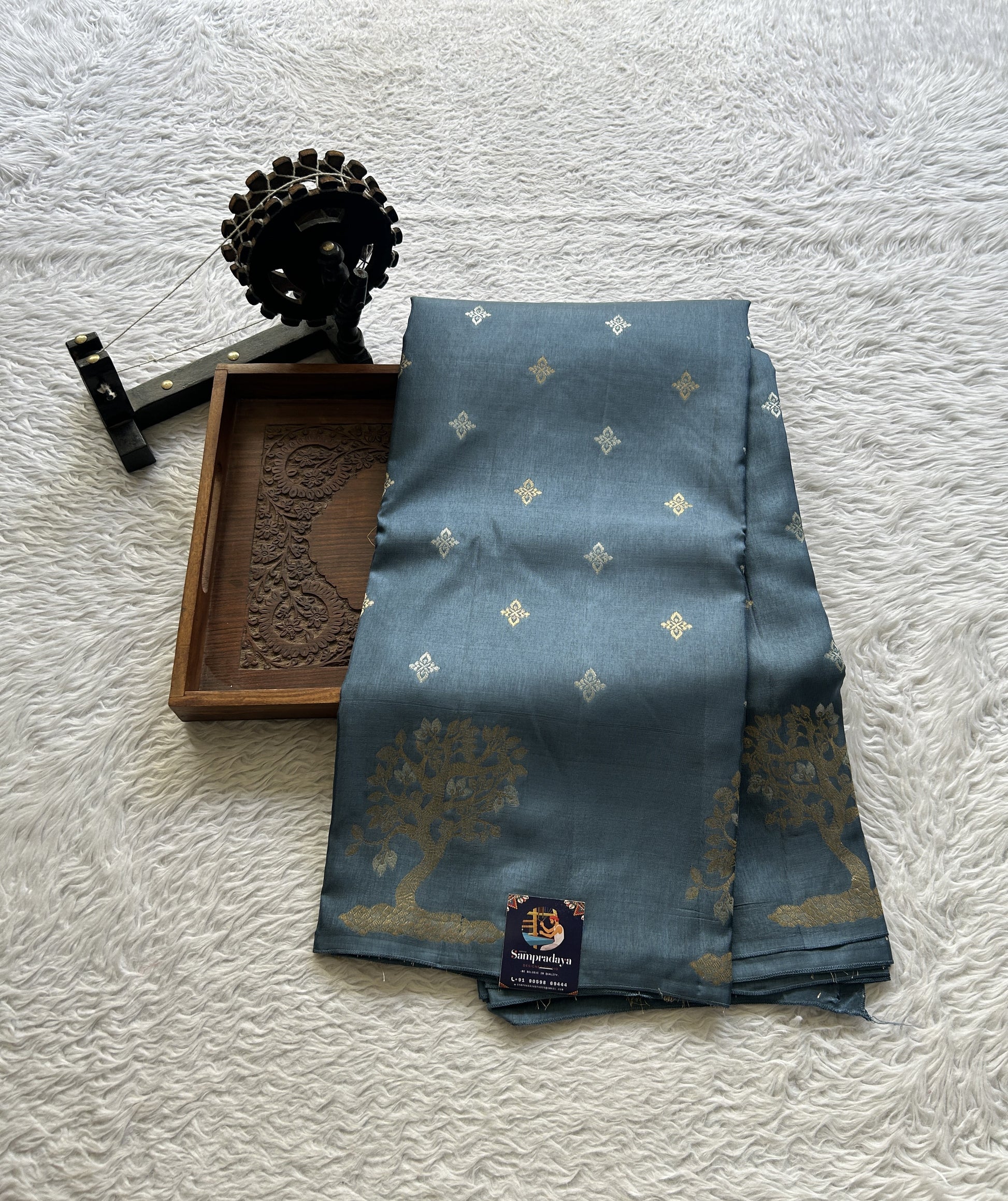 Mona Silk Saree Teal Blue Colored Complemented with a Buti Border. - Sampradaya Designer Studio