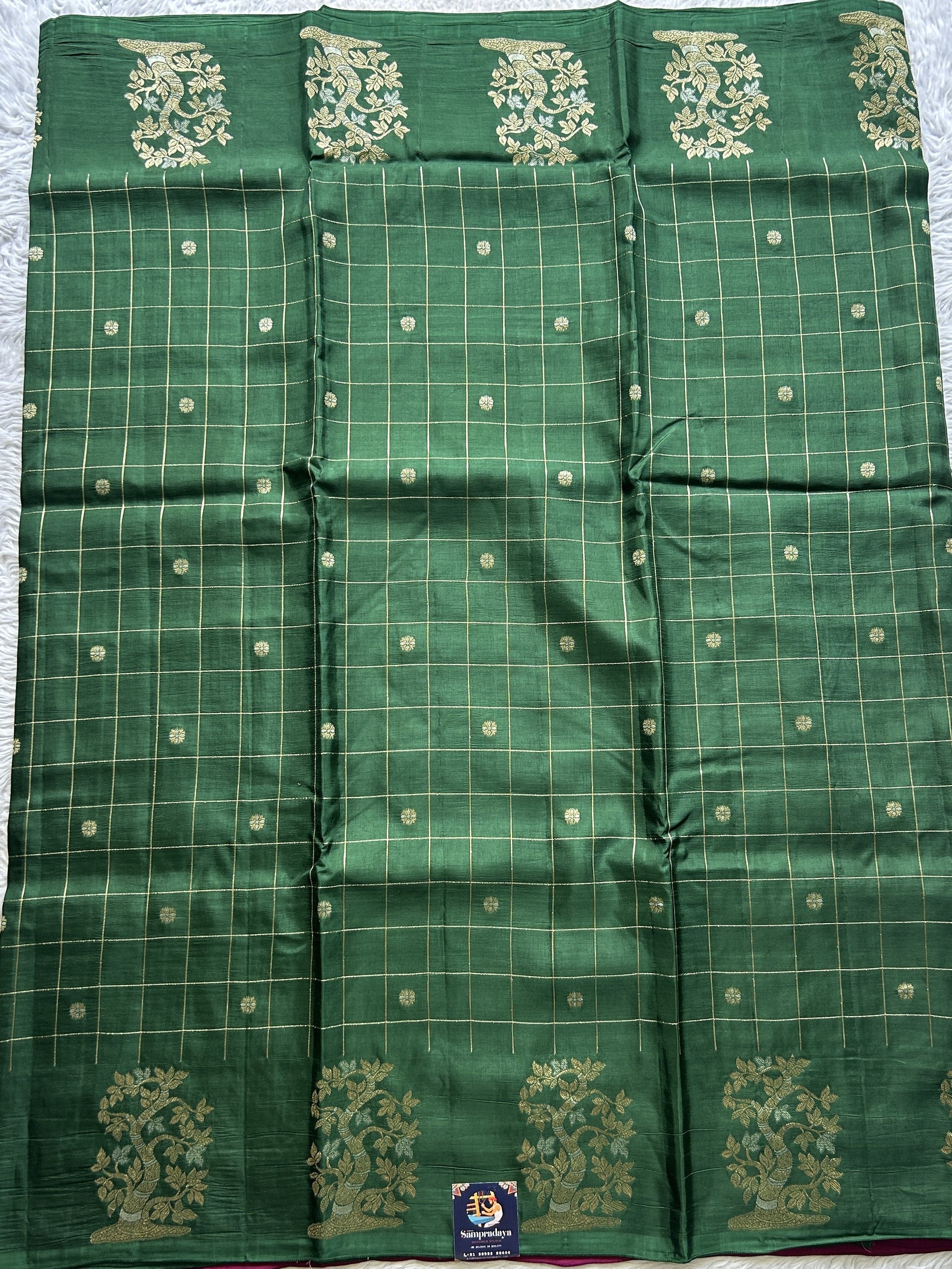 Mona Silk Checks Saree Dark Green Colored Complemented with a Buti Border. - Sampradaya Designer Studio