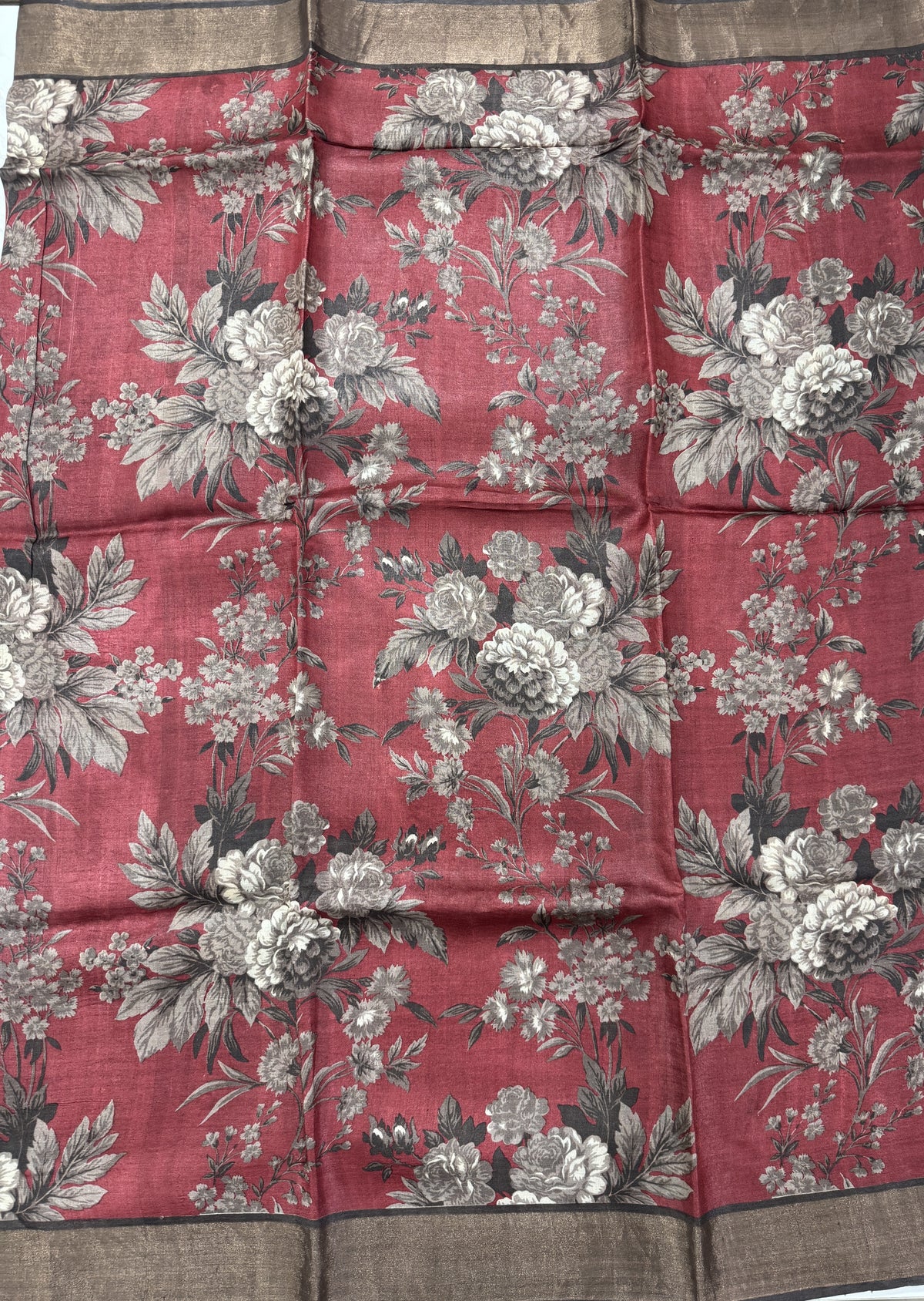 Pure Tussar Silk Saree Crimson Color Complemented with a Zari Border.