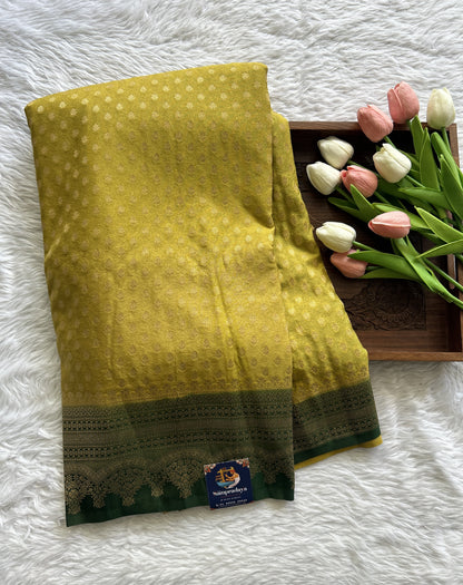 Semi Georgette Saree Lemon Green Colored Complemented with a Bottle Green Color Zari Border. - Sampradaya Designer Studio