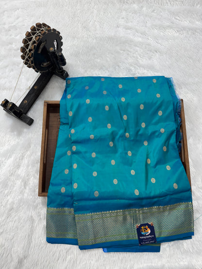 Narayanpet Silk Saree Peacock Green Colored Complemented with a Peacock Green Zari Border.