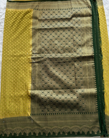 Semi Georgette Saree Lemon Green Colored Complemented with a Bottle Green Color Zari Border. - Sampradaya Designer Studio