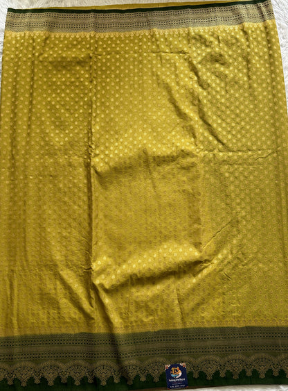 Semi Georgette Saree Lemon Green Colored Complemented with a Bottle Green Color Zari Border. - Sampradaya Designer Studio