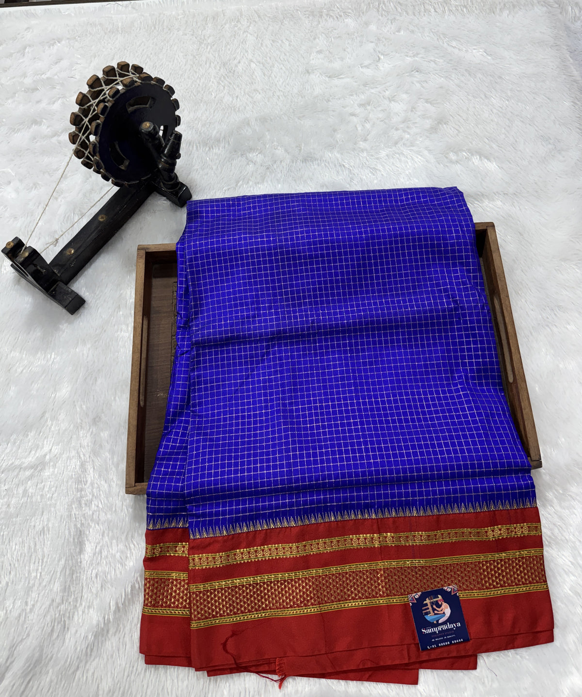 Narayanpet Silk Saree Blue Colored Complemented with a Red Zari Border.