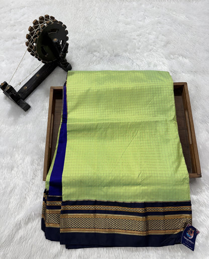 Narayanpet Silk Saree  Light Green Colored Complemented with a Ink Blue Zari Border.