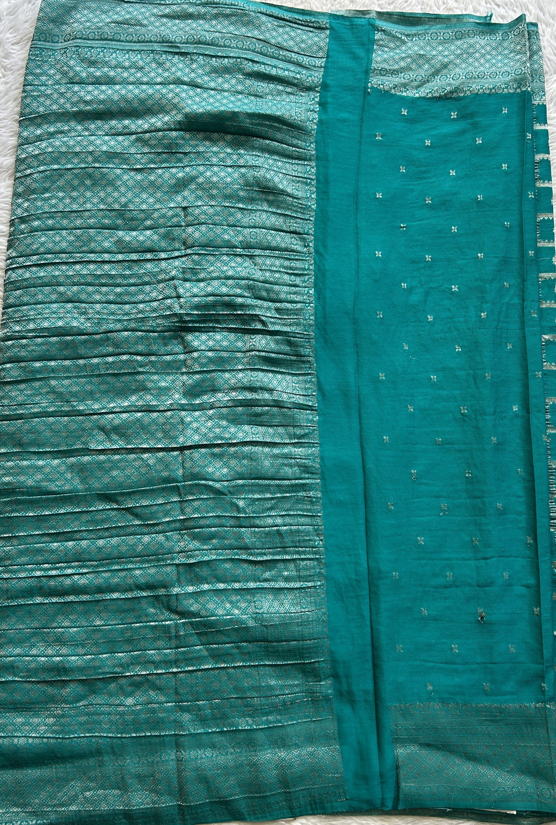 Semi Georgette Saree Turquoise Blue Colored Complemented with a Zari Border. - Sampradaya Designer Studio