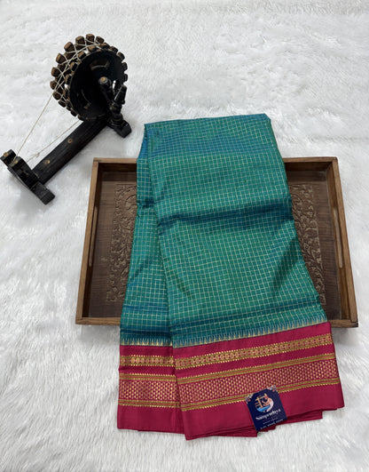 Narayanpet Silk Saree  Green Colored Complemented with a Pink Zari Border.