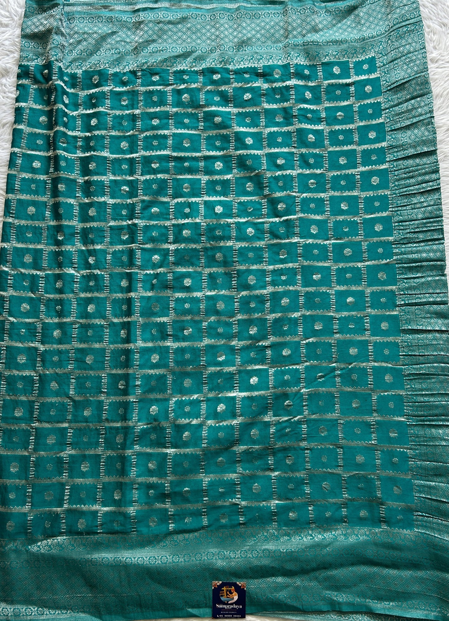 Semi Georgette Saree Turquoise Blue Colored Complemented with a Zari Border. - Sampradaya Designer Studio