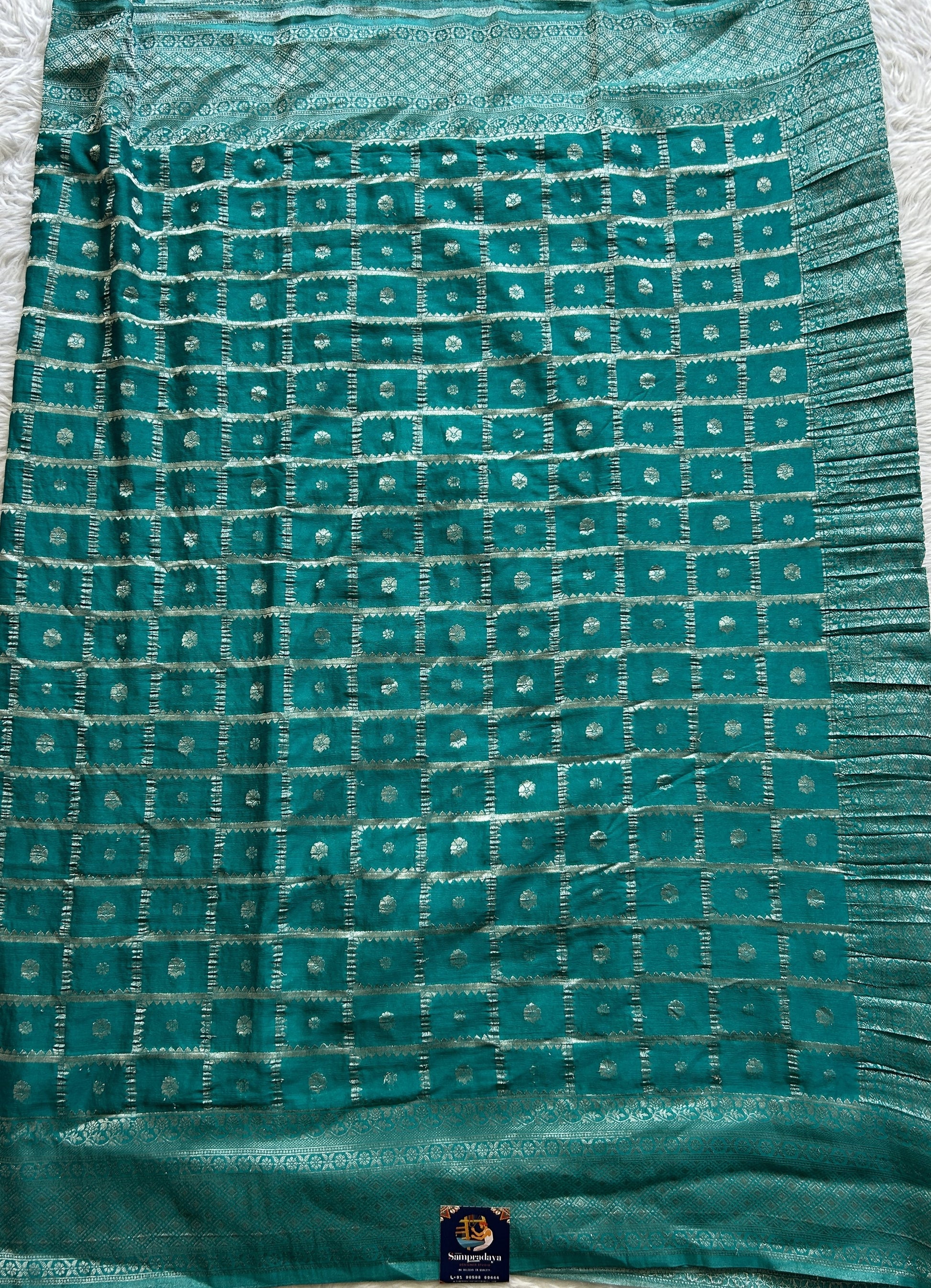 Semi Georgette Saree Turquoise Blue Colored Complemented with a Zari Border. - Sampradaya Designer Studio