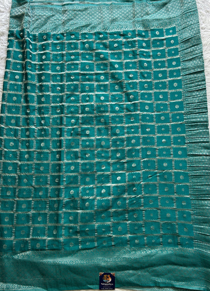 Semi Georgette Saree Turquoise Blue Colored Complemented with a Zari Border. - Sampradaya Designer Studio