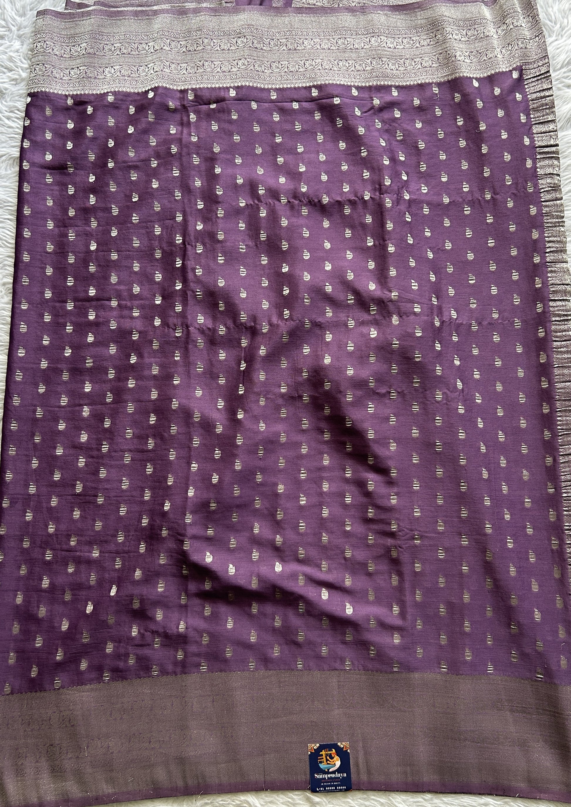 Semi Georgette Saree Dark Purple Colored Complemented with a Zari Border. - Sampradaya Designer Studio