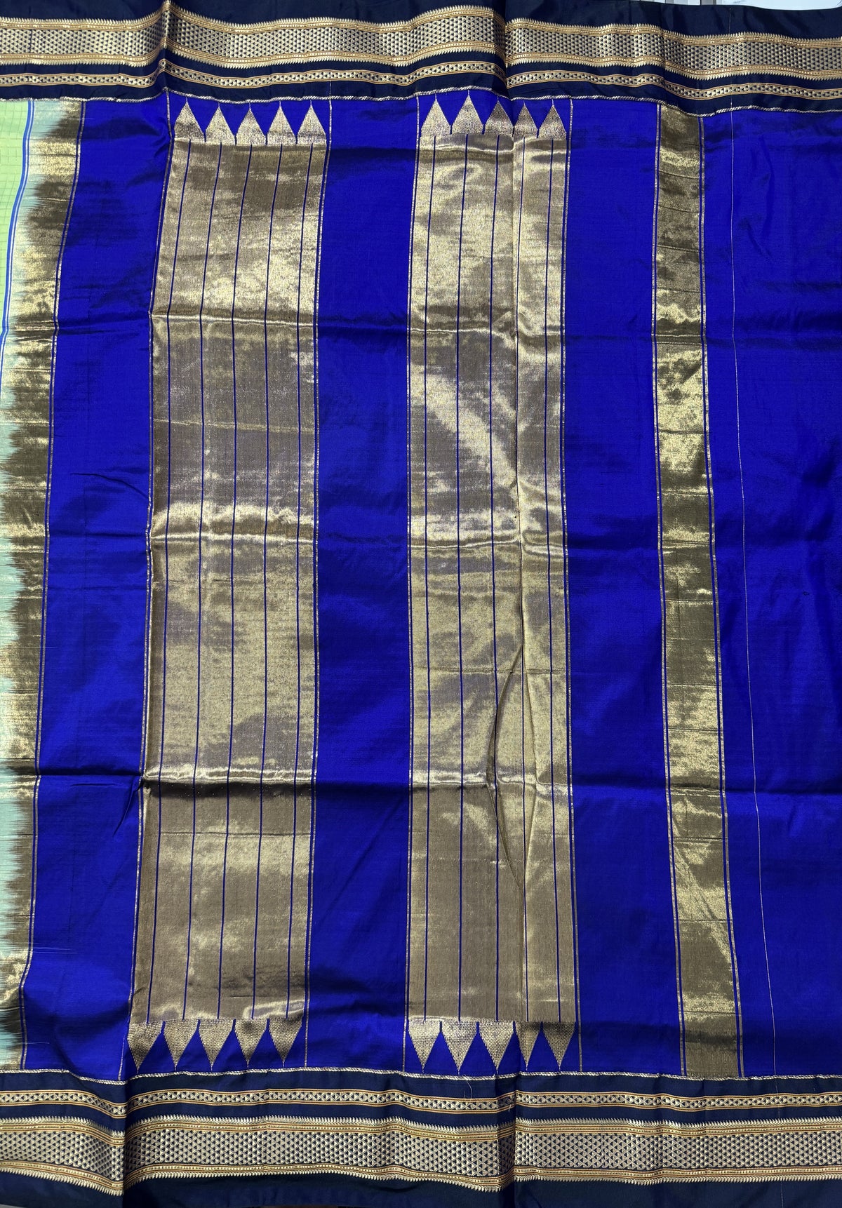 Narayanpet Silk Saree  Light Green Colored Complemented with a Ink Blue Zari Border.