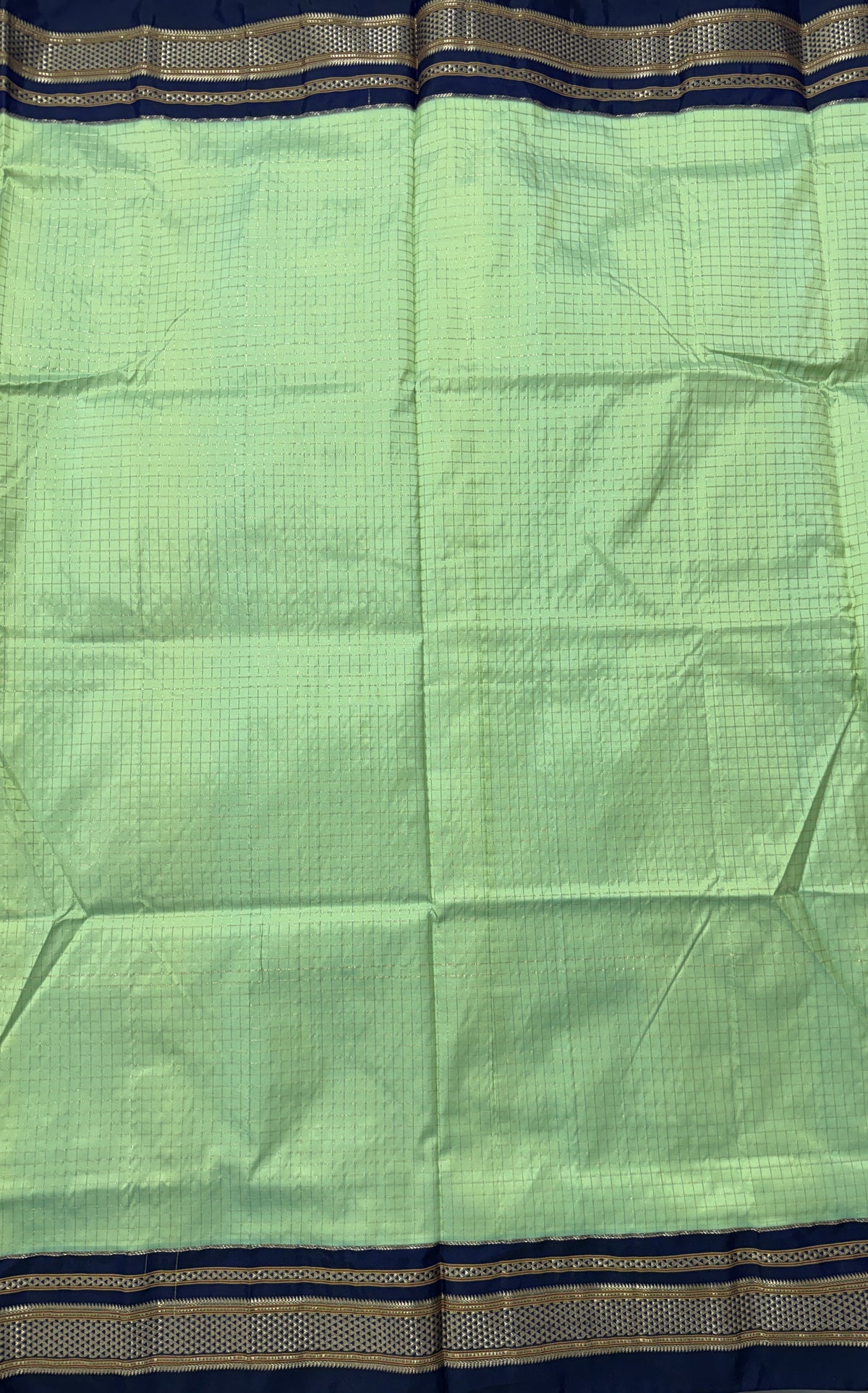Narayanpet Silk Saree  Light Green Colored Complemented with a Ink Blue Zari Border.