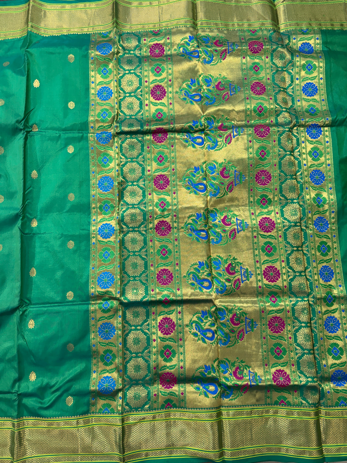 Narayanpet Silk Saree  Green Colored Complemented with a Green Zari Border.