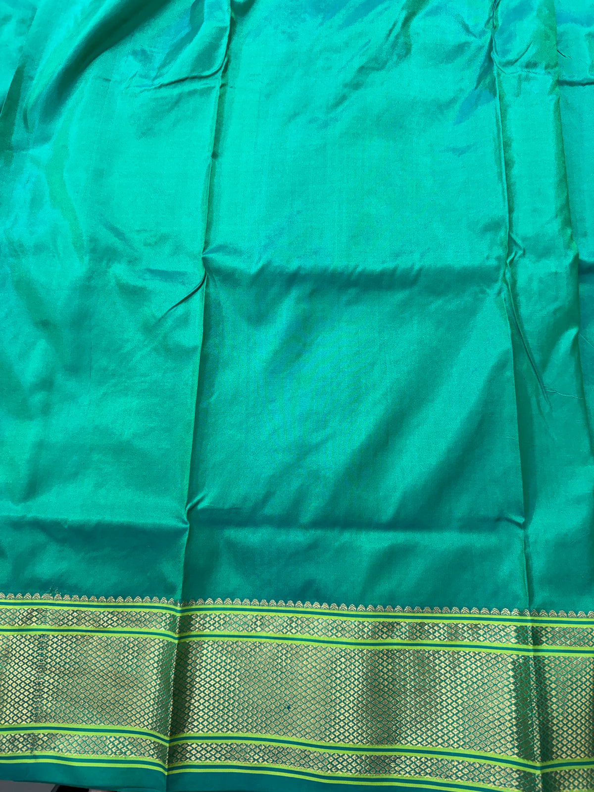 Narayanpet Silk Saree  Green Colored Complemented with a Green Zari Border.