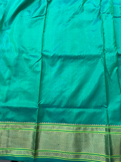 Narayanpet Silk Saree  Green Colored Complemented with a Green Zari Border.