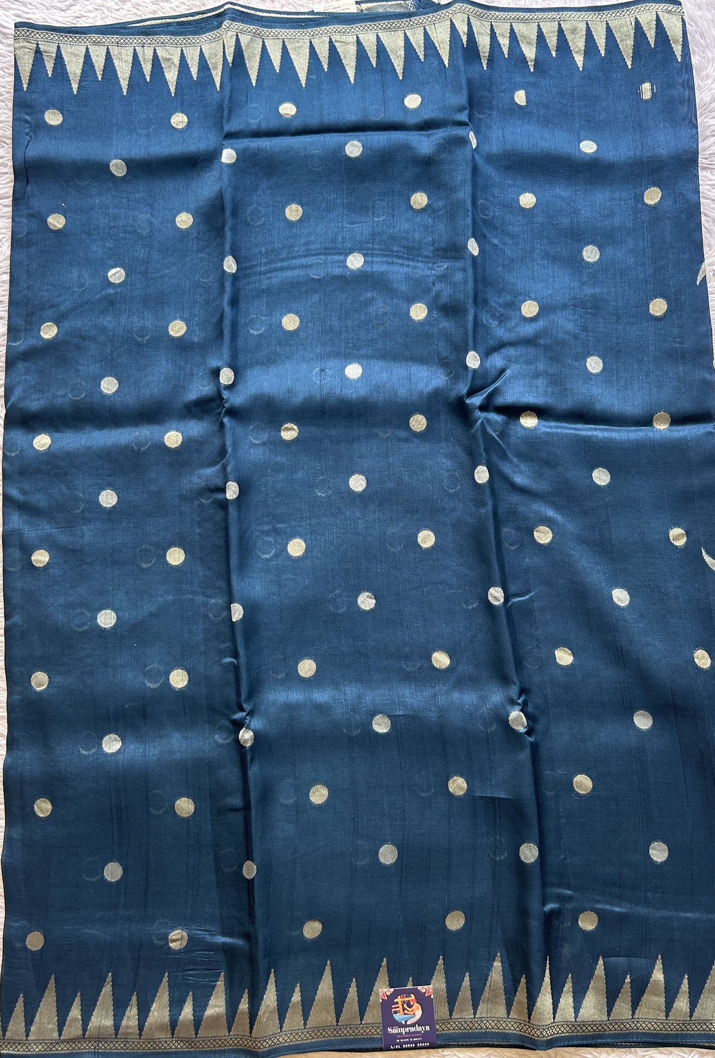 Banarasi Tussar Georgette Saree Peacock Blue Colored Paired with a Temple Border. - Sampradaya Designer Studio