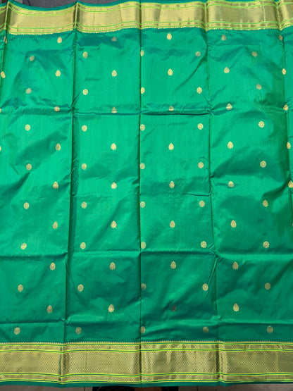 Narayanpet Silk Saree  Green Colored Complemented with a Green Zari Border.