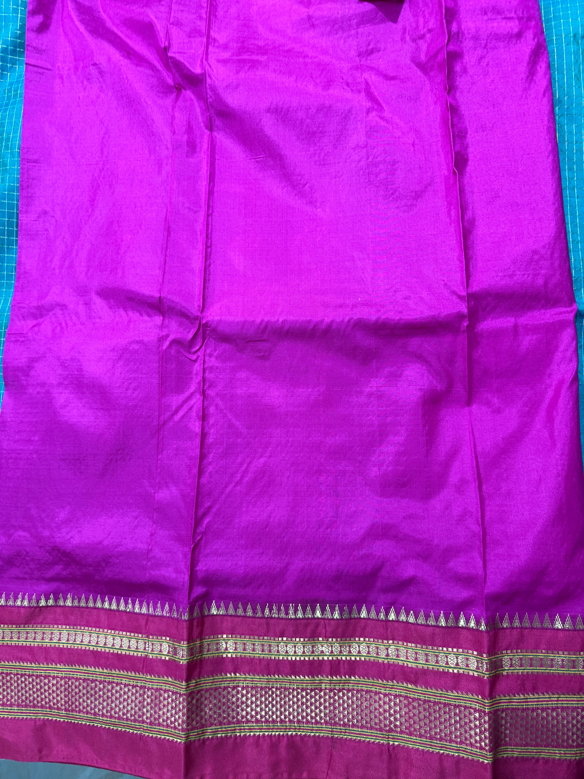 Narayanpet Silk Saree  Green Colored Complemented with a Pink Zari Border.
