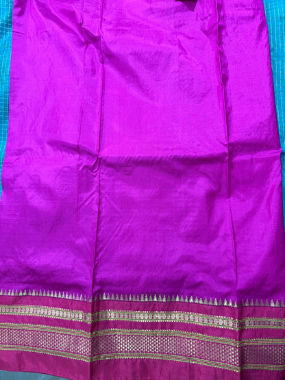 Narayanpet Silk Saree  Green Colored Complemented with a Pink Zari Border.