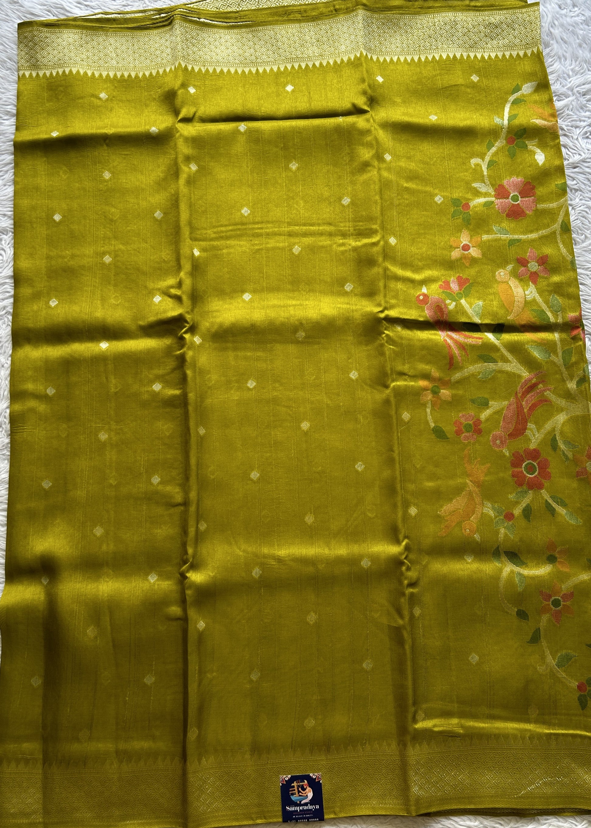 Banarasi Tussar Georgette Saree Olive Green Colored Paired with a Zari Border. - Sampradaya Designer Studio