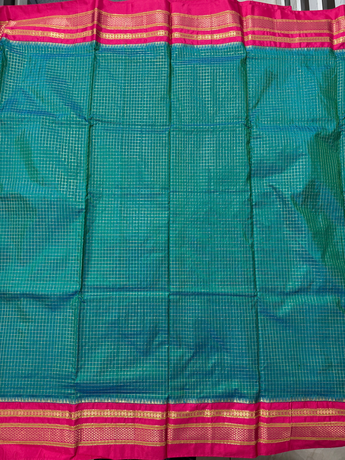 Narayanpet Silk Saree  Green Colored Complemented with a Pink Zari Border.