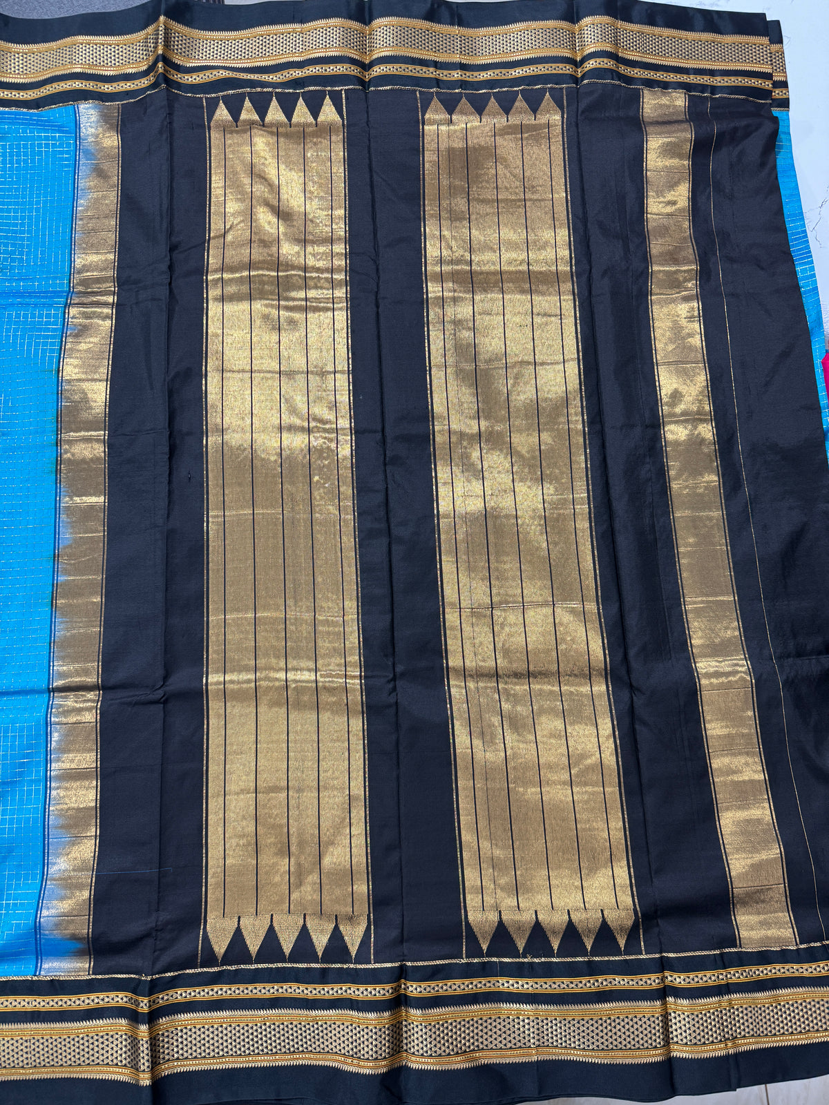 Narayanpet Silk Saree  Blue Colored Complemented with a Black Zari Border.