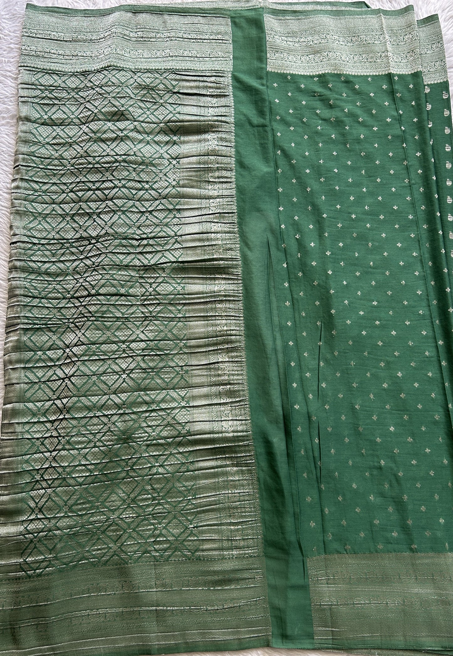 Semi Georgette Saree Green Colored Complemented with a Zari Border. - Sampradaya Designer Studio