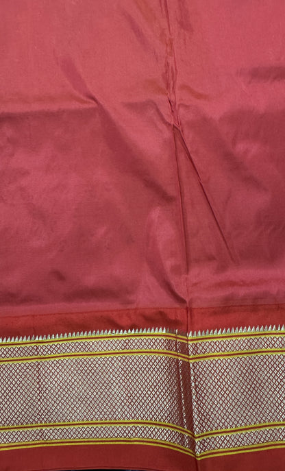 Narayanpet Silk Saree Peach Colored Complemented with a Red Zari Border.