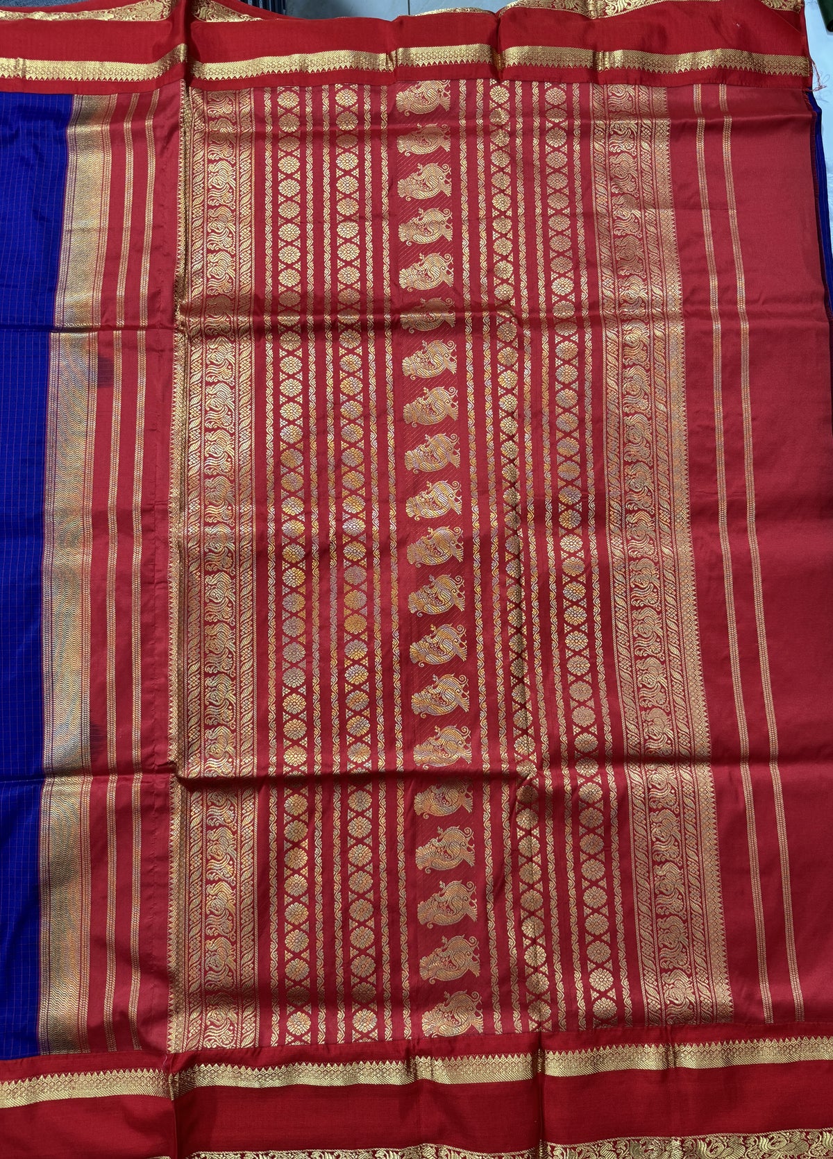 Narayanpet Silk Saree Purple Colored Complemented with a Red Zari Border.