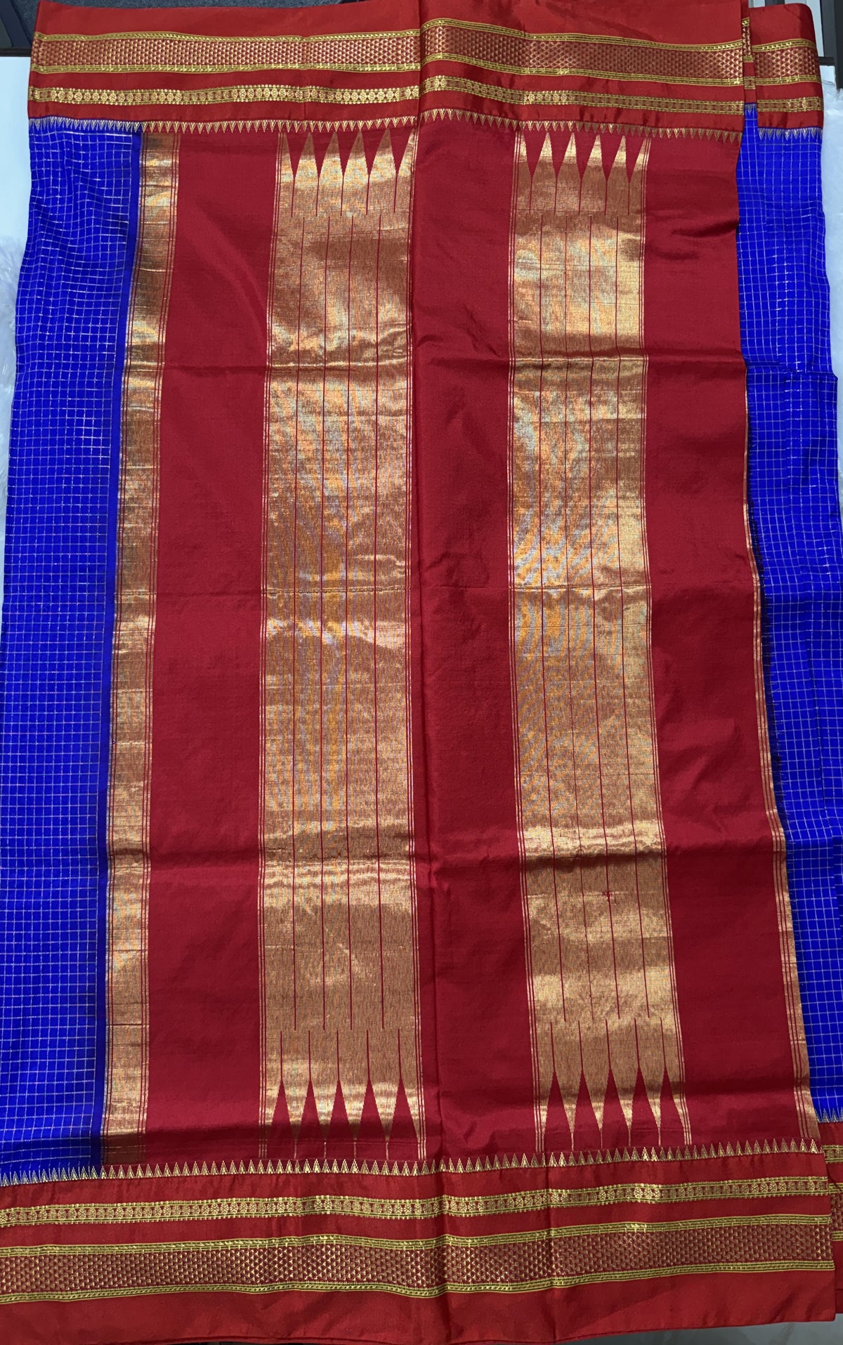 Narayanpet Silk Saree Blue Colored Complemented with a Red Zari Border.