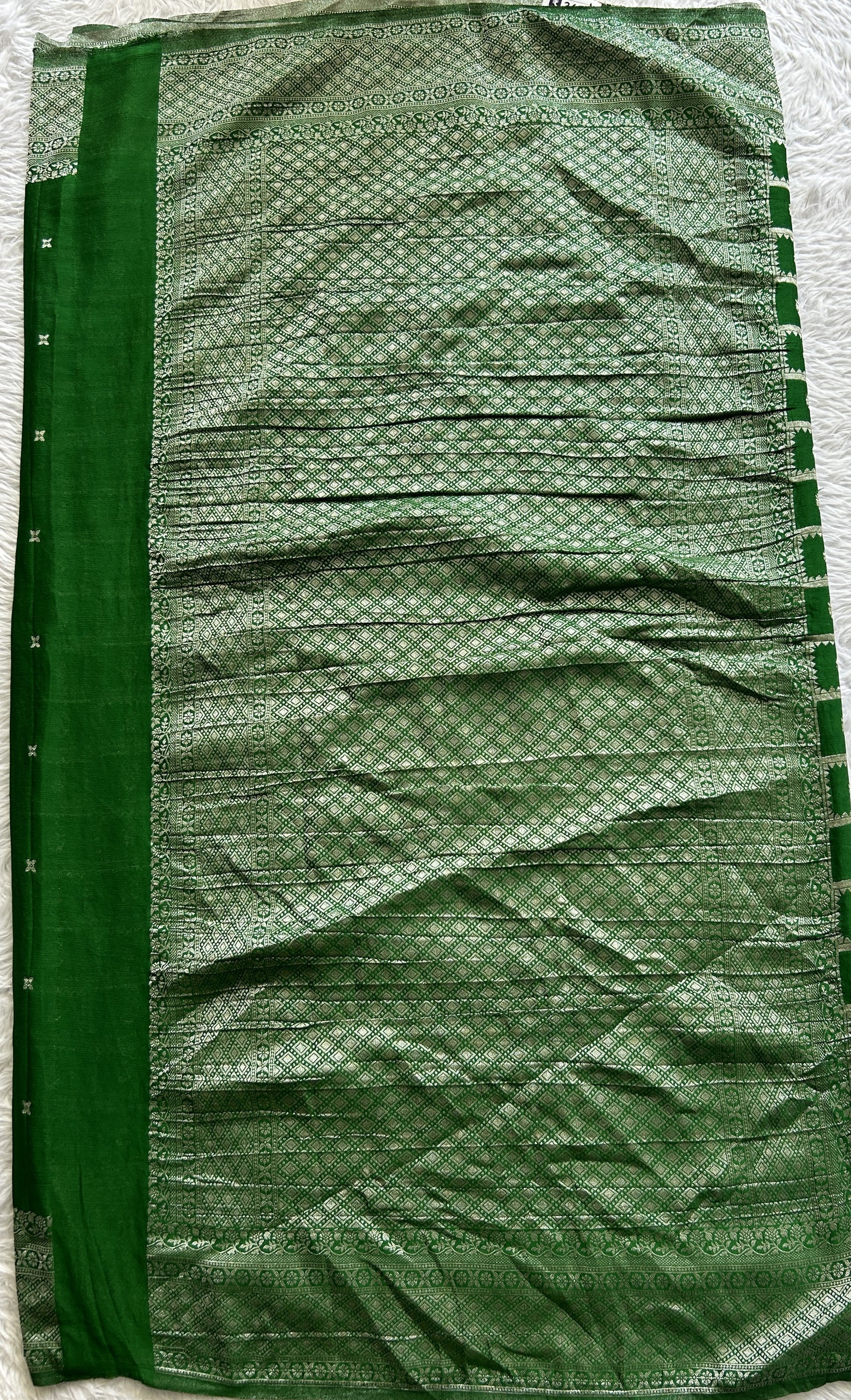 Semi Georgette Saree Green Colored Complemented with a Zari Border. - Sampradaya Designer Studio