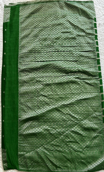 Semi Georgette Saree Green Colored Complemented with a Zari Border. - Sampradaya Designer Studio