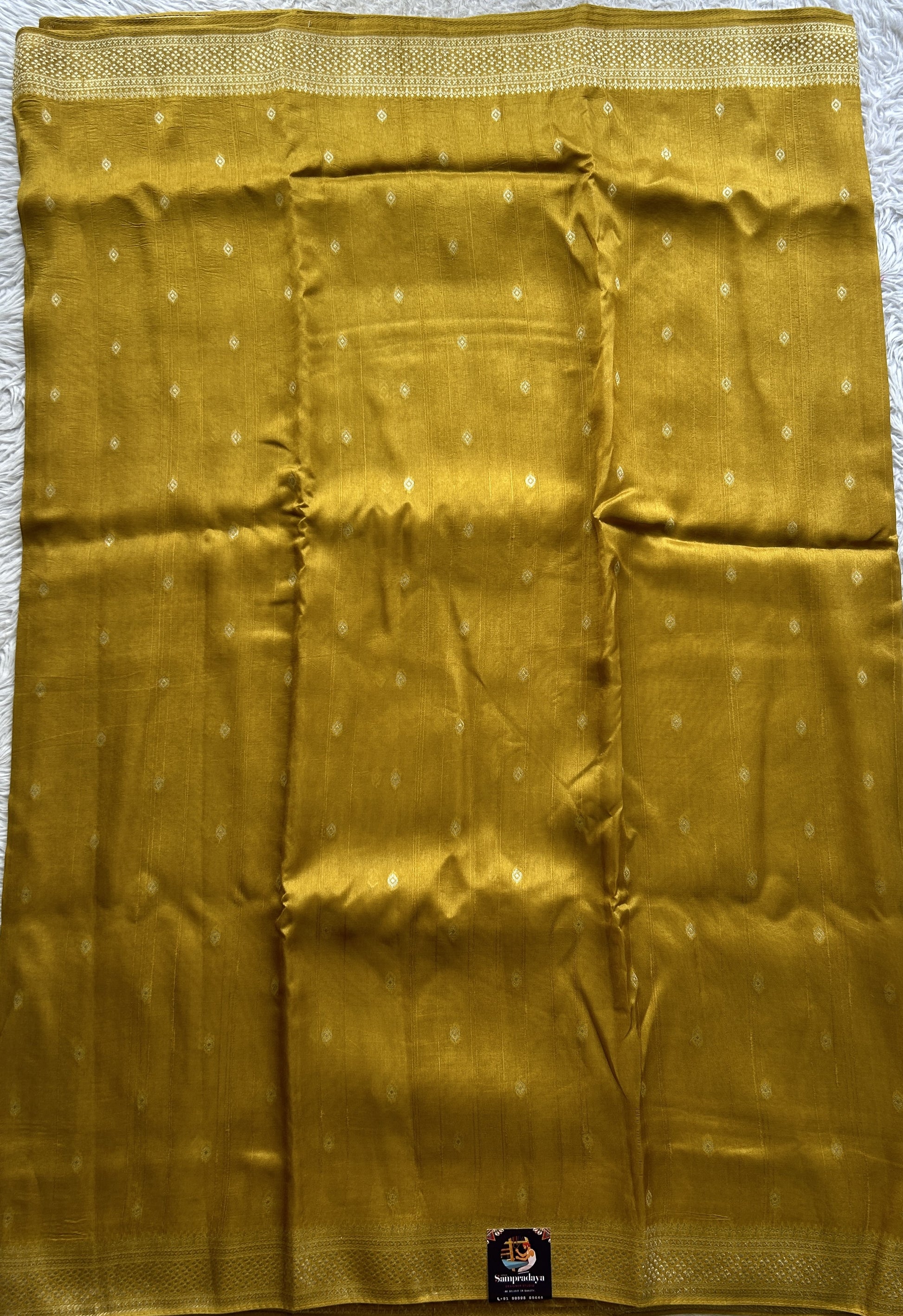 Banarasi Tussar Georgette Saree Mustard Yellow Colored Paired with a Zari Border. - Sampradaya Designer Studio