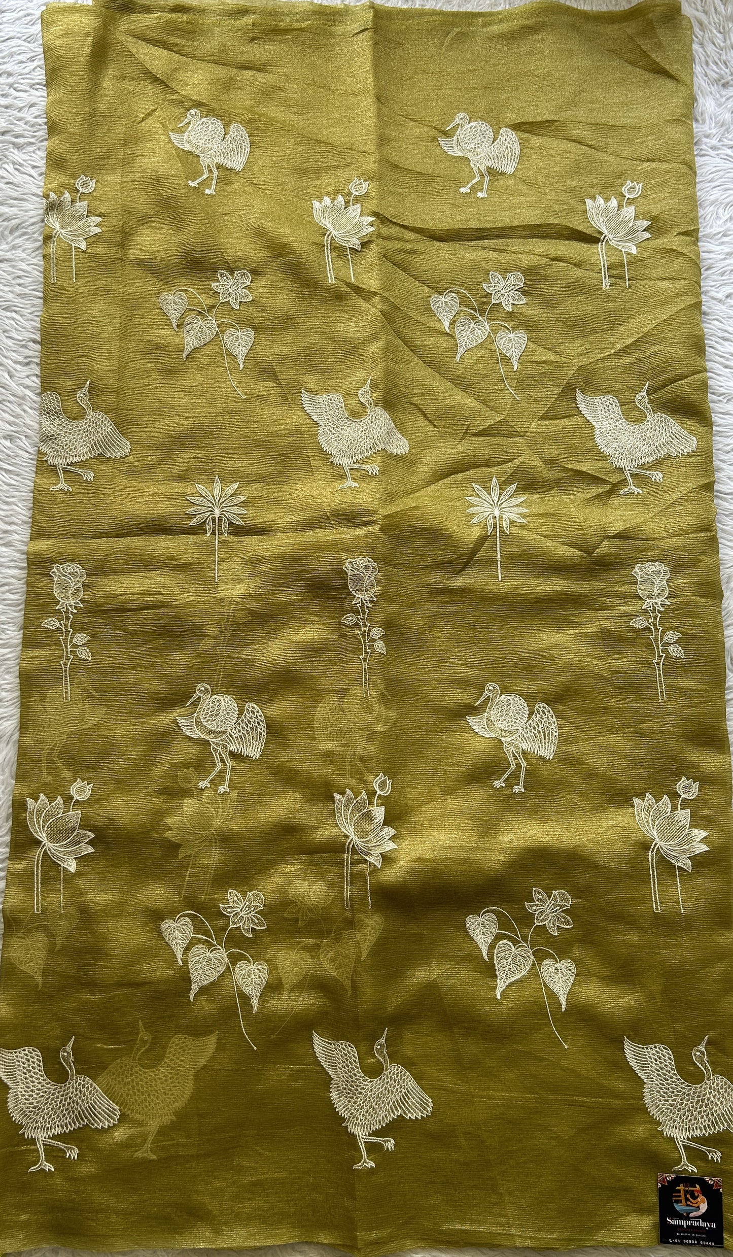 Banarasi Fancy Crushed Saree Leaf Green Colored Complemented with a Borderless. - Sampradaya Designer Studio