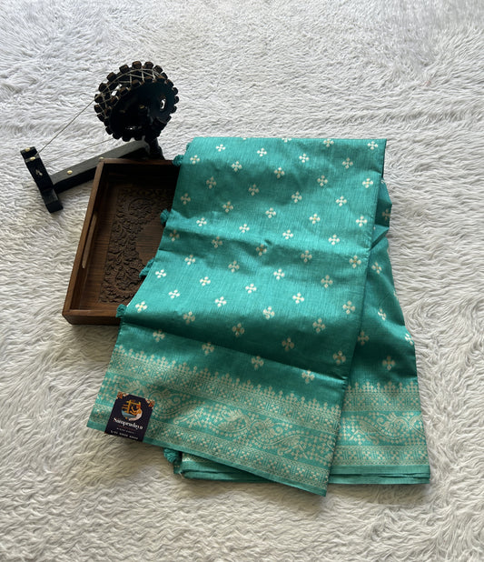 Semi Raw Silk Saree Turquoise Colored Elegantly Paired with a Zari Border. - Sampradaya Designer Studio