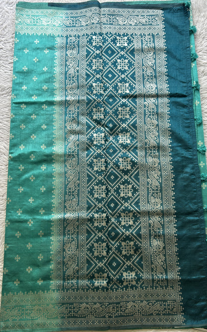 Semi Raw Silk Saree Turquoise Colored Elegantly Paired with a Zari Border. - Sampradaya Designer Studio