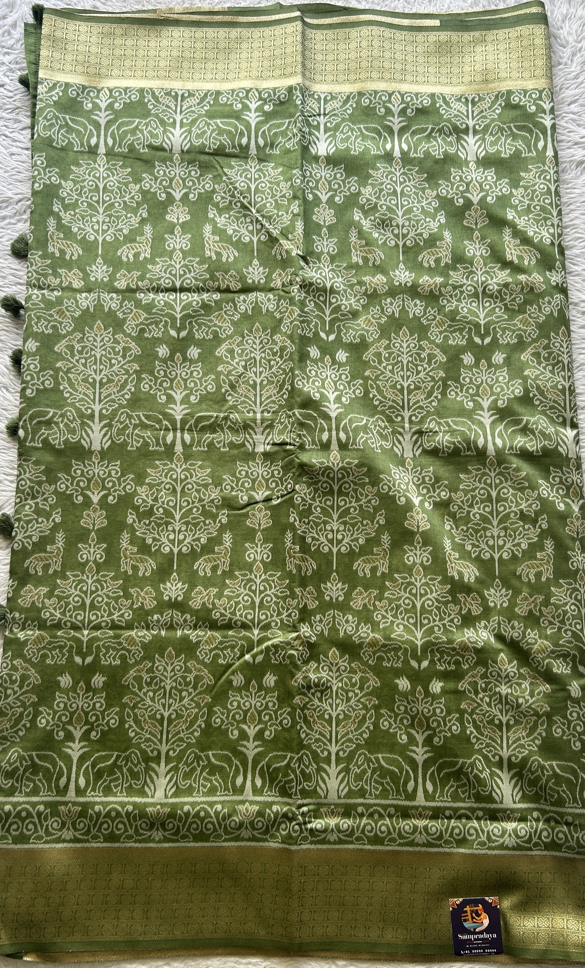 Semi Raw Silk Allover Saree Green Colored Elegantly Paired with a Zari Border. - Sampradaya Designer Studio